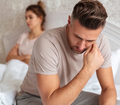 Image of Sad unhappy couple having problem in bed